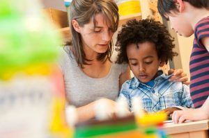 Teacher reading with children